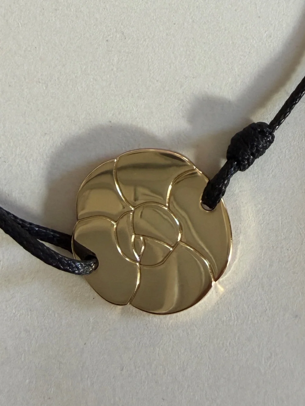 CHANEL CAMELIA CORD BRACELET
